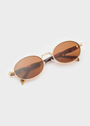 Occhiali da sole ovali con montatura dorata