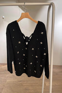 Cardigan nero con applicazioni