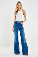 Jeans scuri a vita alta con bottoni decorativi