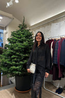 Blusa nera in chiffon con fiocco