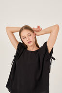 Blusa over con maniche arricciate